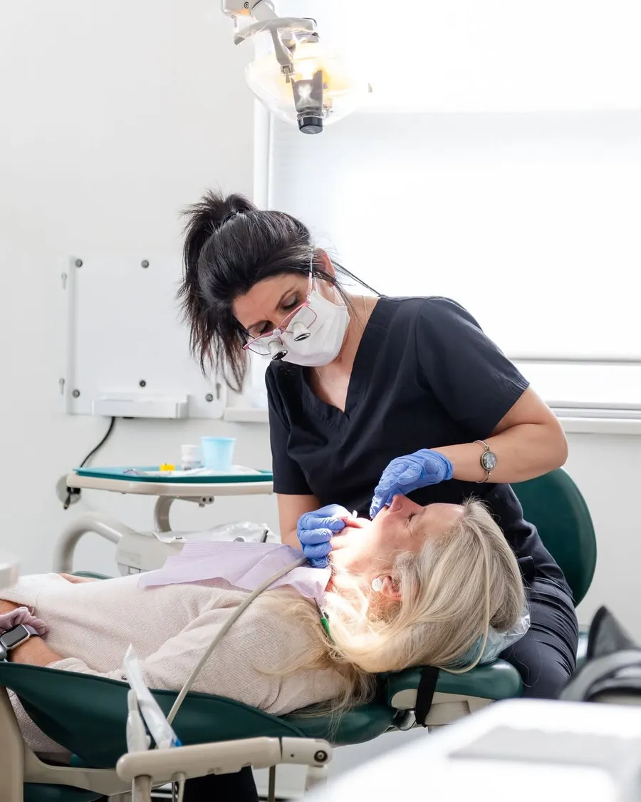 Infinity Dental Wellness hygienist providing a fluoride-free cleaning in Fort Lee, NJ