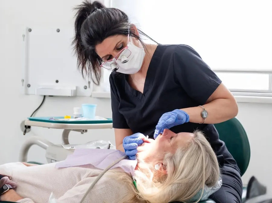 Infinity Dental Wellness hygienist caring for a patient in Fort Lee, NJ